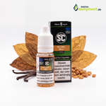 Delicate Mild Tabak E-Zigaretten Liquid Flasche und Packung vor Tabakblättern und Vanilleschoten.